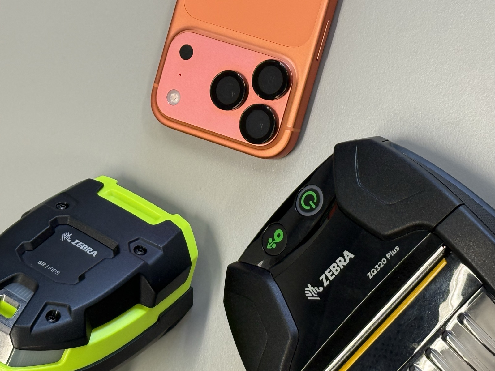 Zebra scanner and RFID reader next to an iPhone